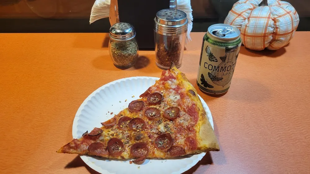 Slice of Pepperoni Pizza and a Beer